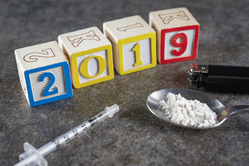 2019 Year of the Drugs?  Syringe with a spoon with white powder (white flour to depict illegal...