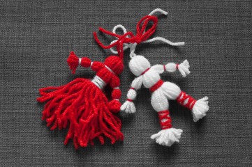 Martenitsa, white and red strains of yarn, Bulgarian folklore tradition, welcoming the spring in...