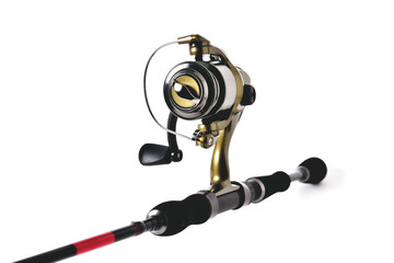 fishing reel on a fishing rod, white background close-up, copy space