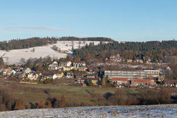 Fototapeta na wymiar panoramic view on a small city in the harz mountains in germany in winter 