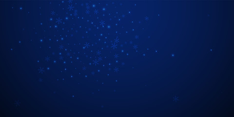 Sparse glowing snow Christmas background. Subtle f