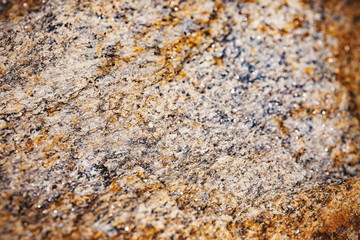 Selected focus at the center of rusty and dusty brown stone surface texture with blurry and vignette border, Abstract grunge nature background.