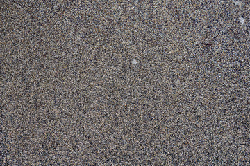 Texture of wet sand backgroud. Grey colours
