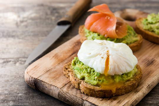 Toasted breads with poached eggs, avocado and salmon

