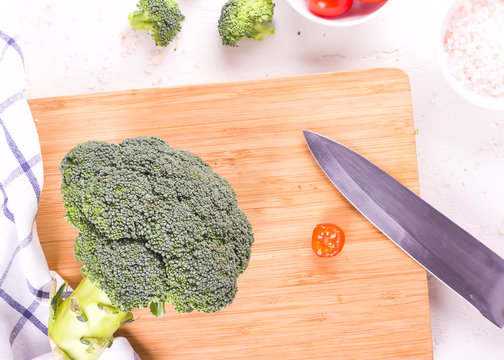 Healthy diet vegan food, wonam cooking vegetables meal from broccoli and tomatoes.