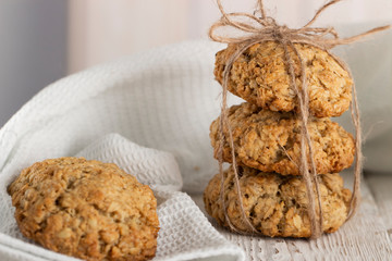Oatmeal cookies with milk on tray on rustic wooden table