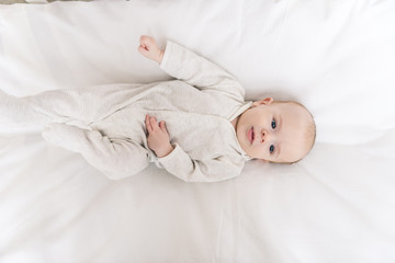 overhead view of cute little baby in crib