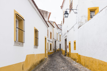 Fototapeta na wymiar Narrow cobble-stoned street in Évora, Portugal