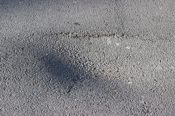 Asphalt road dent hole crater erosion damage