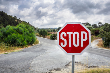 STOP warning traffic sign on a road