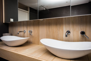 Two modern sink in the bathroom, and big mirror, new empty house