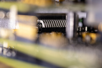 Close up (Macro) of Printed Circuit Board PCB embedded components (inductors, resistors, capacitors, diodes, microchips, transistor) with short depth of view.