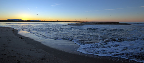 Sunrise over temporary tidal outflow of the Santa Clara river estuary at McGrath State Park on California's Gold Coast at Ventura - Oxnard in California United States