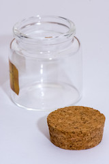 The small glass jar and the lid of it