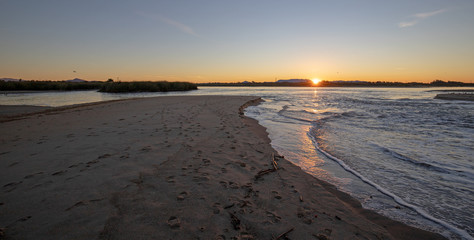 Morning sunrise reflections over temporary tidal inlet of the Santa Clara river estuary at McGrath State Park on California's Gold Coast at Ventura - Oxnard in California United States