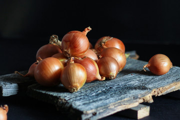 crispy onion treats a bunch of old boards in a dark place