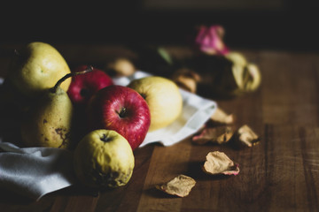 Vegetables on a wooden plane - Organic apples and pears grown without pesticides and chemicals - Bio  and healthy food concept - Dark background and vintage color style.