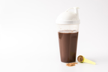 Chocolate protein shake isolated on white background. Copyspace