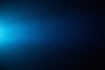 A beam of light on a color wall