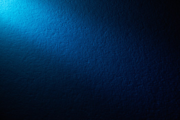 A beam of light on a color wall