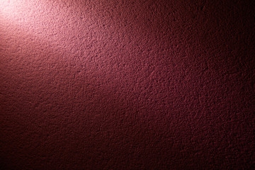 A beam of light on a color wall