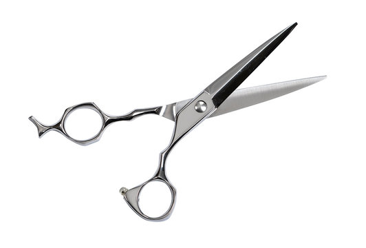 A pair of scissors for cutting hair. Isolated