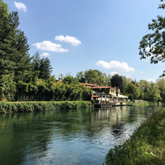 Fototapeta na wymiar Beautiful house on the river in Milan