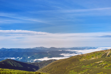 Beautiful scenery with clouds high in the mountains.