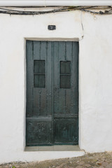 Fototapeta na wymiar Old Portuguese, front door, entrance with ornaments, antique