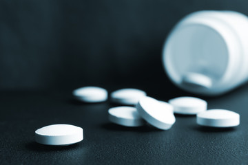 scattered pills on the table.toned