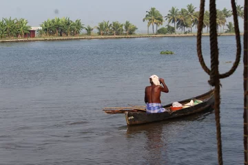 Foto op Canvas old man and the boat © JagadeeshChandra