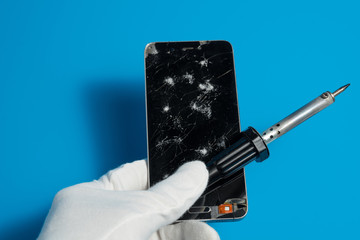 Repair smartphones with a broken screen on a blue background