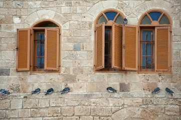 Windows in stone wall of Jaffa mosque. Israel.
