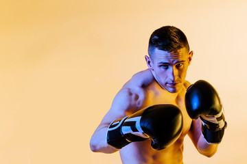 Studio portrait of boxer in defense position