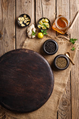 Fototapeta na wymiar Herbal Tea Ingredients - Tea Leaves, Honey, Ginger, Lemon and Mint Leaves