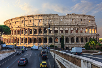 Fototapeta na wymiar Coliseum in Rome and a street nearby, Italy, sunrise view