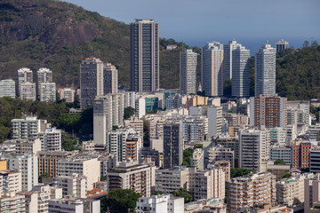Urban view of many tall buildings in Rio de Janeiro with the natural surrounding in the background