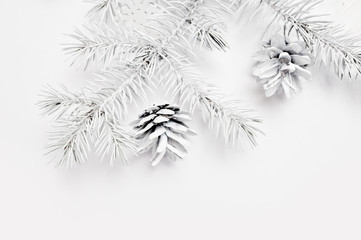 Mockup Christmas white tree and cone. Flat lay on a white wooden background, with place for your text. Top view