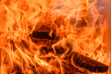 lot of fire flames of heavily burning wood in stove