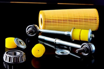Close-up of stabilizer bar with hinge, oil seals, bearing and filter for car repair