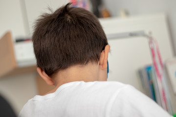 Obraz premium young boy studying tired and stressed