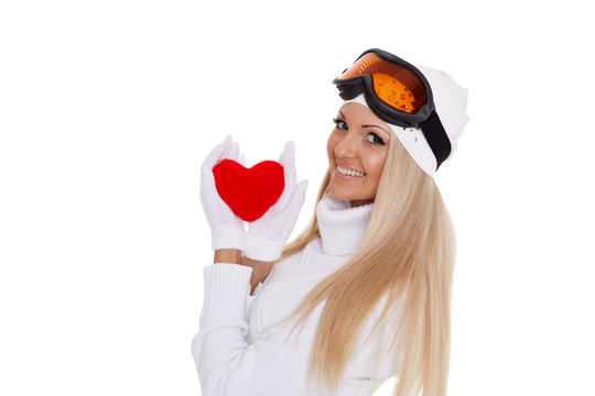 Young woman with red heart in hands