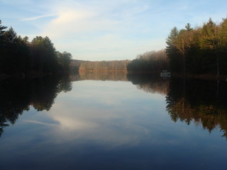 Fototapeta na wymiar Reflections on a Still Lake