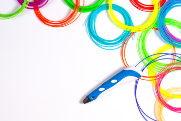 3d pen with colourful plastic filament on white background