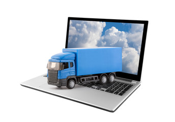Blue truck on laptop isolated on white background 