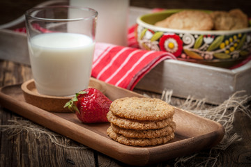Stack of freshly baked oat biscuits in a bowl.