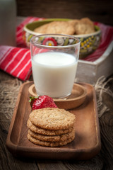 Stack of freshly baked oat biscuits in a bowl.