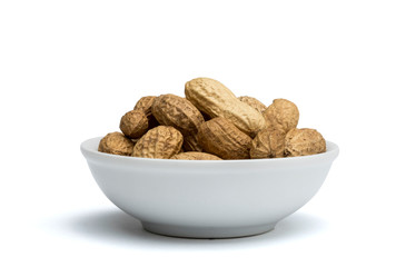 withe bowl with peanuts with peel