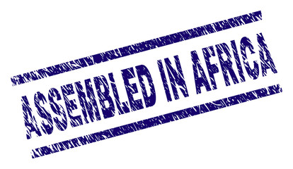 ASSEMBLED IN AFRICA seal stamp with scratced style. Blue vector rubber print of ASSEMBLED IN AFRICA label with unclean texture. Text label is placed between parallel lines.