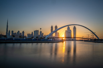 Fototapeta na wymiar city harbour bridge at sunrise in Dubai, UAE